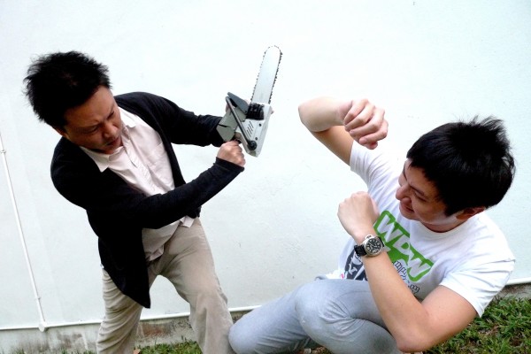 l1000695_2 Noel Yeo (left) and Shawn Loo demonstrate an alternative use for the i.Saw